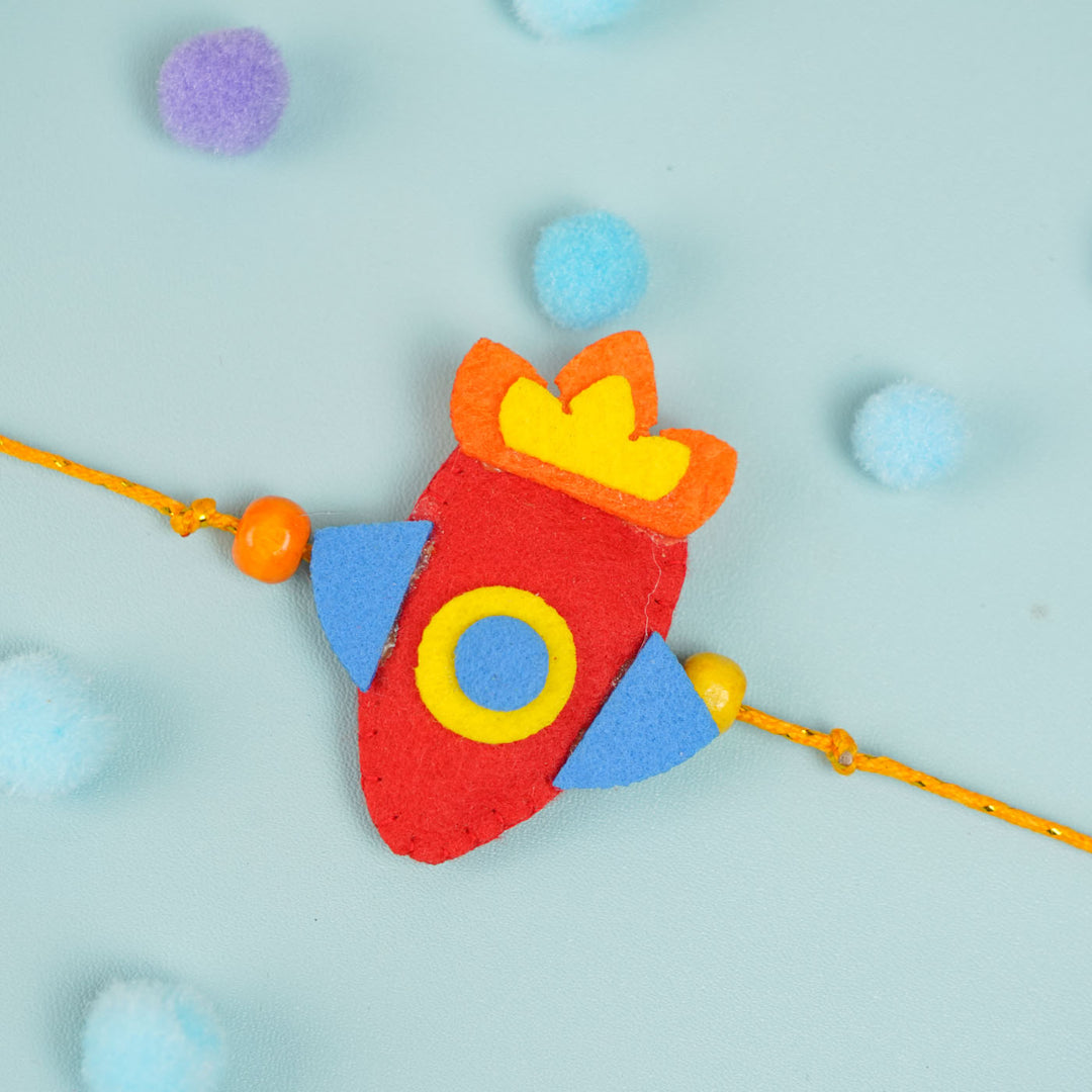 Handmade Beaded Rocket Theme Felt Rakhi With Roli Chawal For Kids - Top View