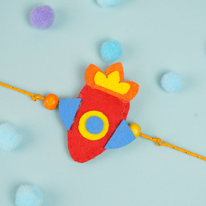 Handmade Beaded Rocket Theme Felt Rakhi With Roli Chawal For Kids - Top View