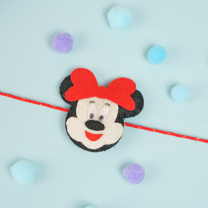 Handmade Beaded Mickey Mouse Theme Pom Pom Felt Rakhi With Roli Chawal For Kids - Top View with Colorful Decorations