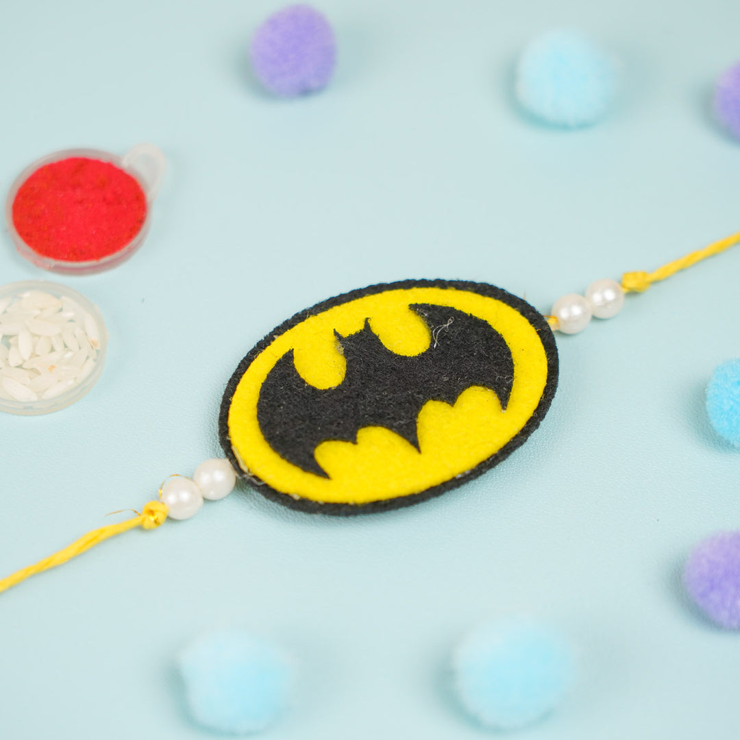 Handmade Beaded Batman Theme Pom Pom Felt Rakhi With Roli Chawal For Kids - Top View Showing Details