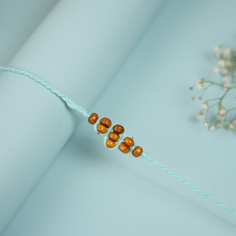 Handmade Beaded Neeltara Rakhi With Roli Chawal Set Of 5 - Close-up of Single Bracelet Detail
