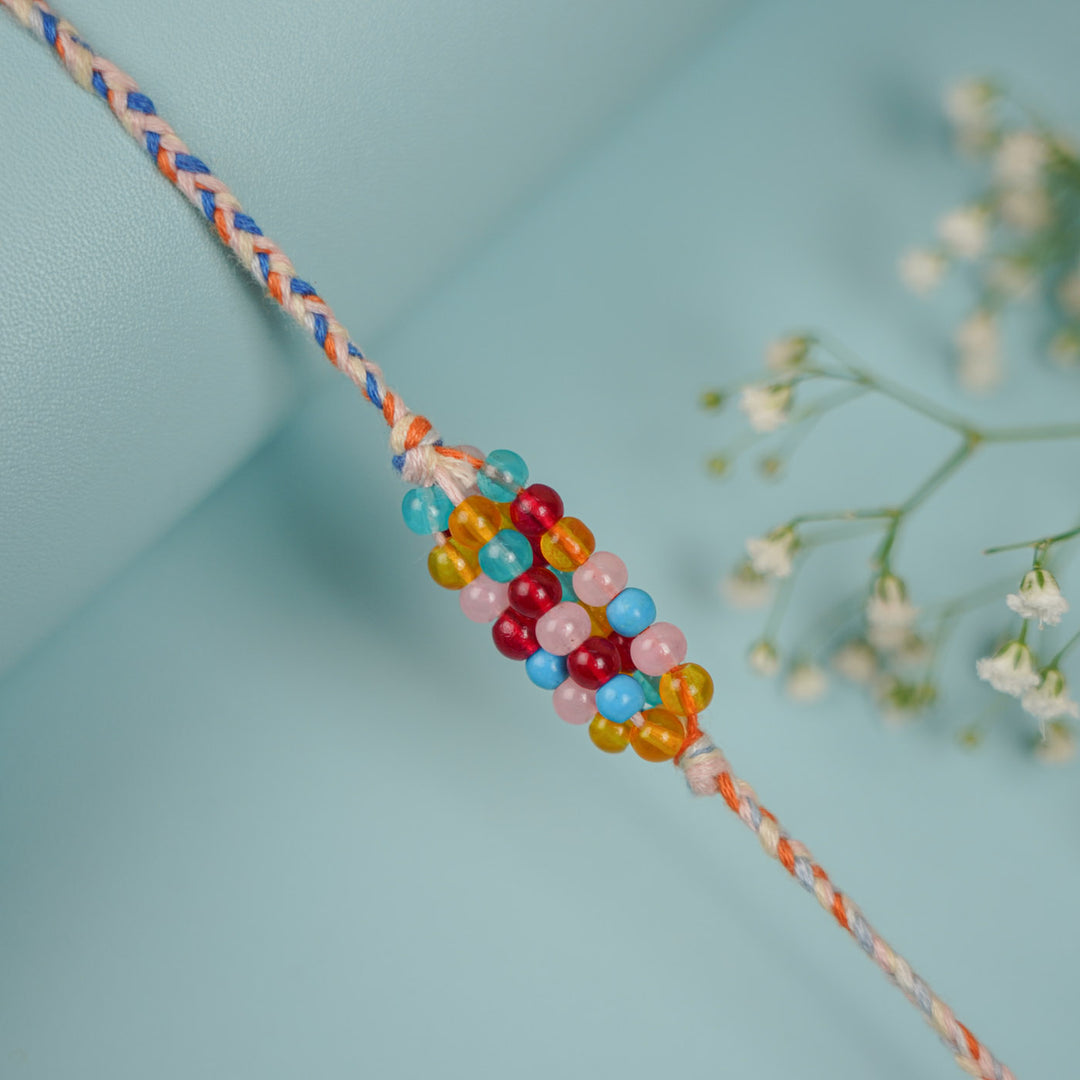 Handmade Beaded Multicolour Rang Rakhi With Roli Chawal - Close-up of Beaded Detail