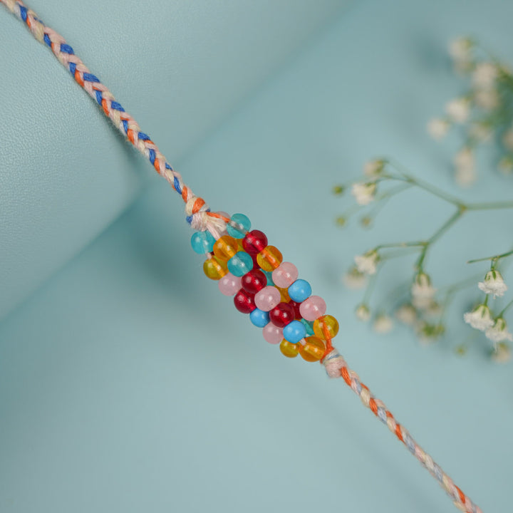 Handmade Beaded Multicolour Rang Rakhi With Roli Chawal - Close-up of Beaded Detail