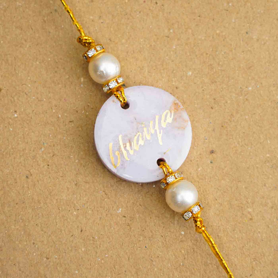 Personalized Handmade Lavendar Resin Rakhi With Roli Chawal - Name Personalization Close-up