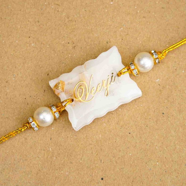 Personalized Handmade White Resin Rakhi With Roli Chawal - Close-up of Personalized Rakhi