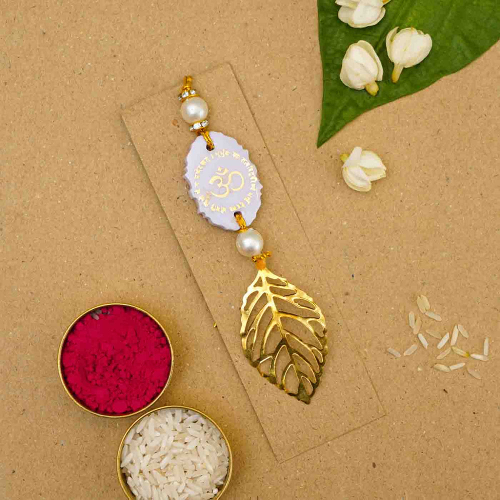 Personalized Handmade Lavendar Resin Lumba Rakhi For Bhabhi With Roli Chawal - Flat Lay with Festive Items