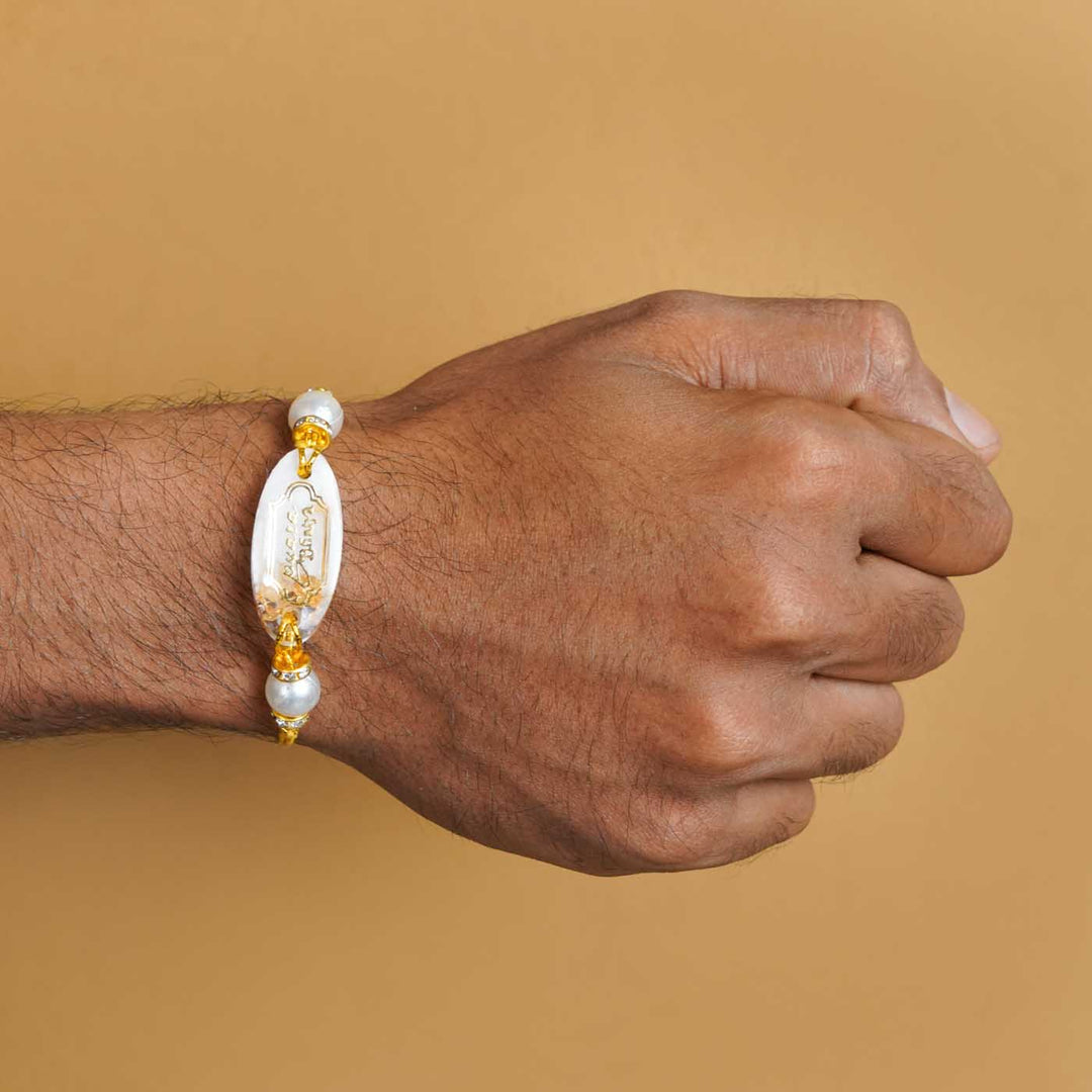 Personalized Handmade White Resin Rakhi With Roli Chawal - Worn on Wrist Display (7)