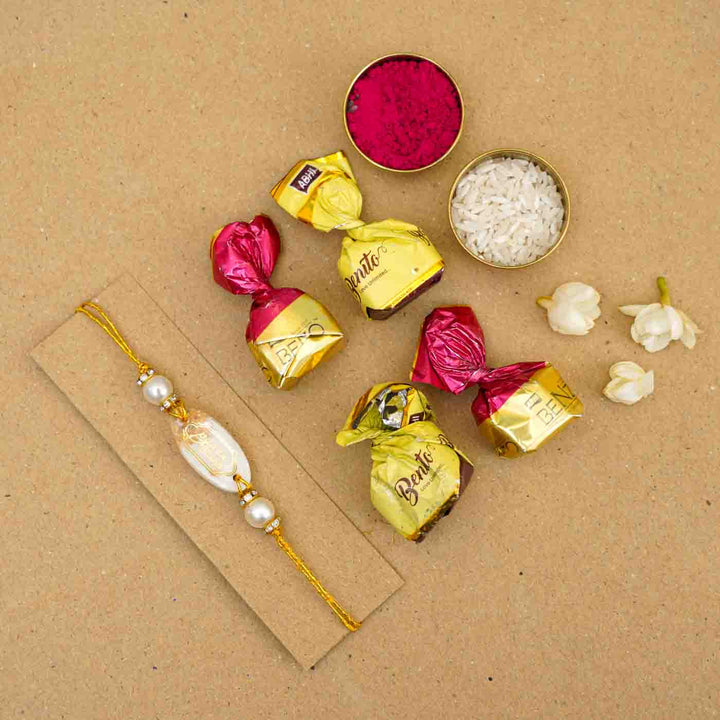 Personalized Handmade White Resin Rakhi With Roli Chawal - Flat Lay with Chocolates (8)