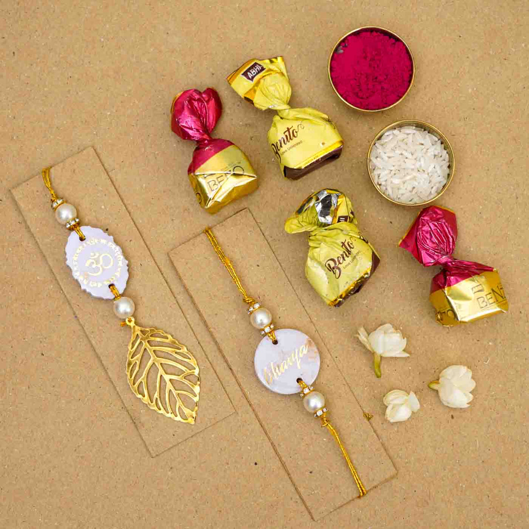 Personalized Handmade Lavendar Resin Bhaiya Bhabhi Rakhi With Roli Chawal Set Of 2 - Flat Lay with Decorative Items