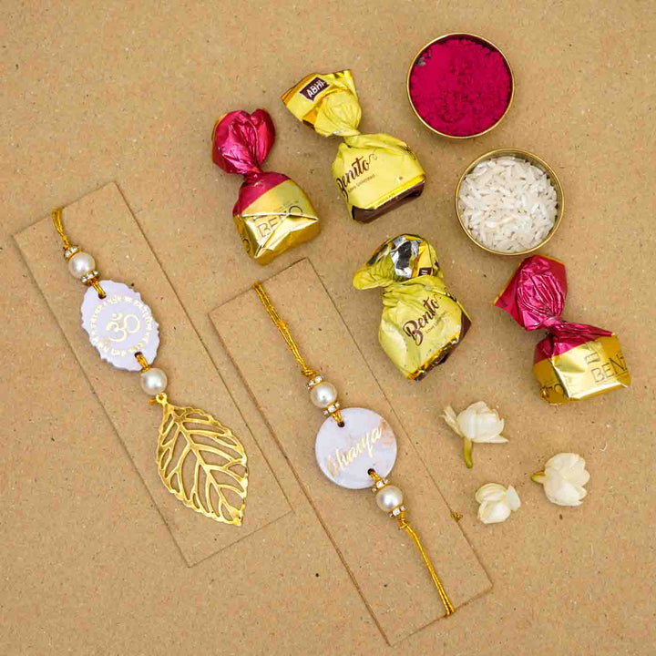 Personalized Handmade Lavendar Resin Bhaiya Bhabhi Rakhi With Roli Chawal Set Of 2 - Flat Lay with Decorative Items