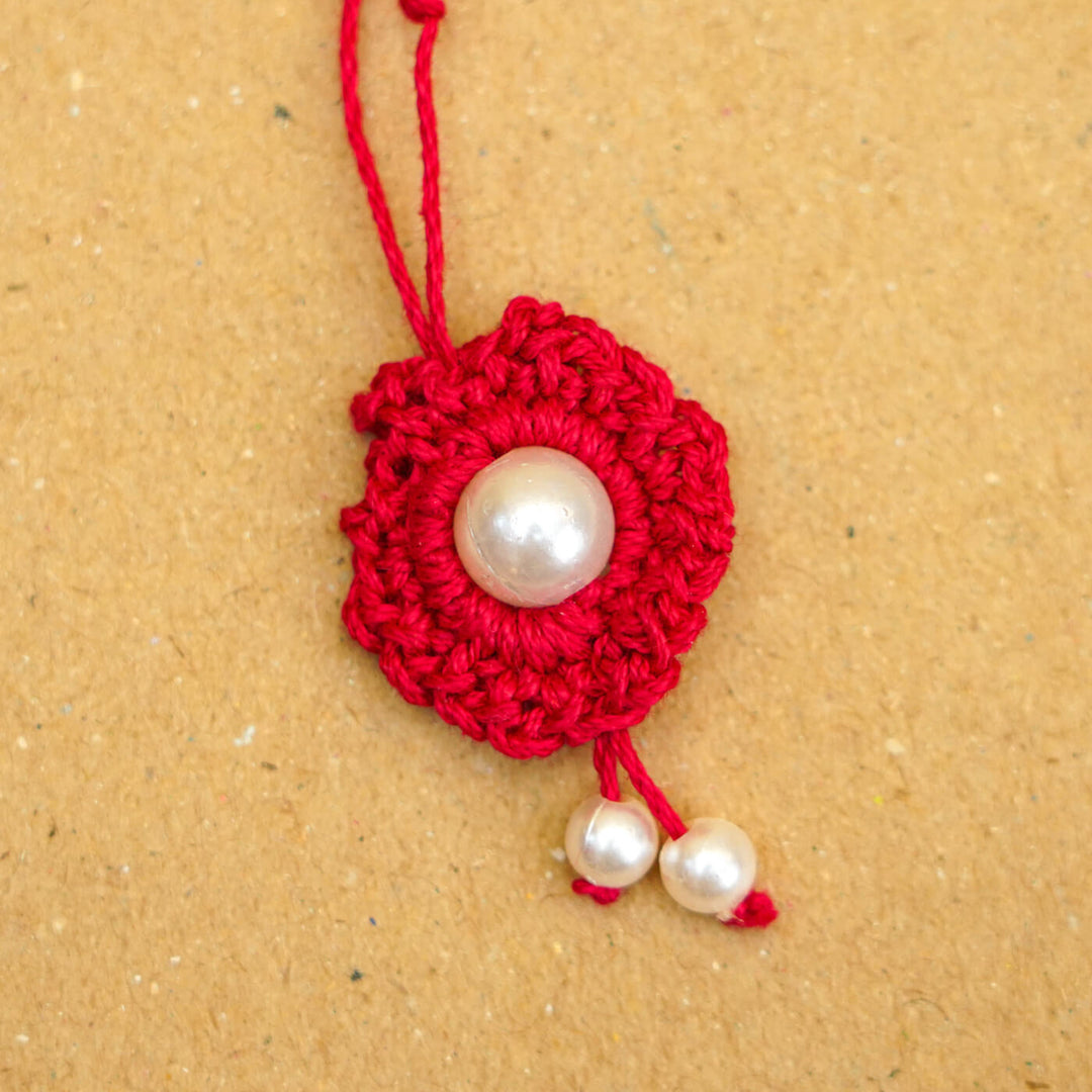 Handmade Crochet Round Pearl Cotton Lumba Rakhi For Bhabhi With Roli Chawal - Close-up of bracelet end detail (16)