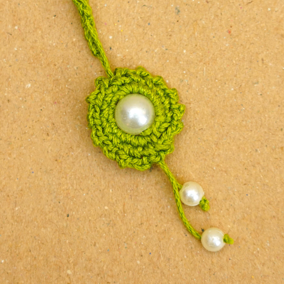Handmade Crochet Round Pearl Cotton Lumba Rakhi For Bhabhi With Roli Chawal - Close-up of bracelet end detail (8)