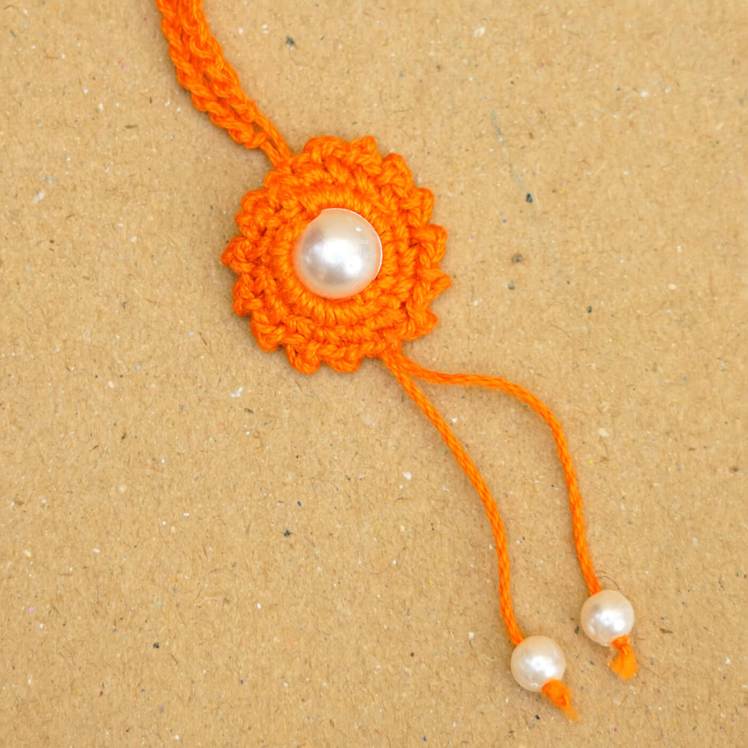 Handmade Crochet Round Pearl Cotton Lumba Rakhi For Bhabhi With Roli Chawal - Close-up of bracelet end detail (12)