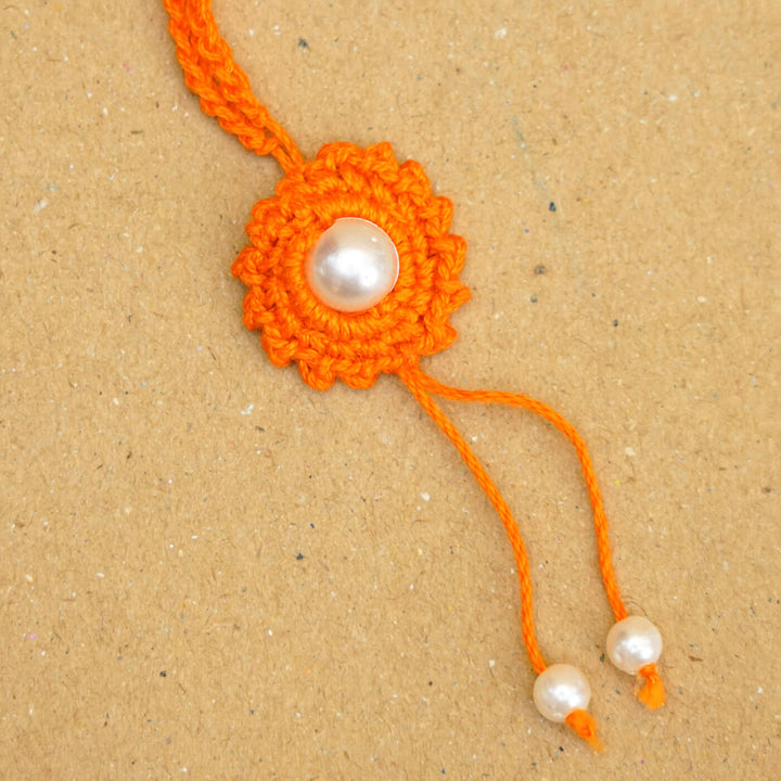 Handmade Crochet Round Pearl Cotton Lumba Rakhi For Bhabhi With Roli Chawal - Close-up of bracelet end detail (12)