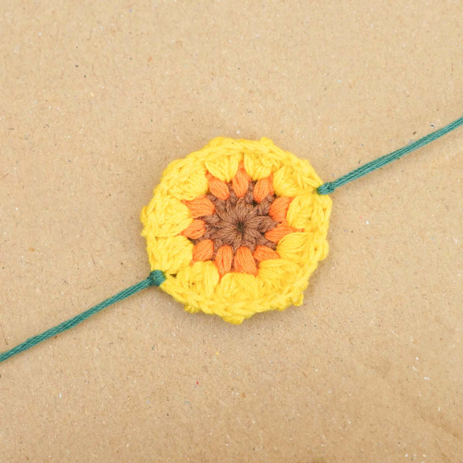 Eco Friendly Handmade Plantable Sunflower Theme Kids Rakhi With Roli Chawal - Close-up of Crochet Detail