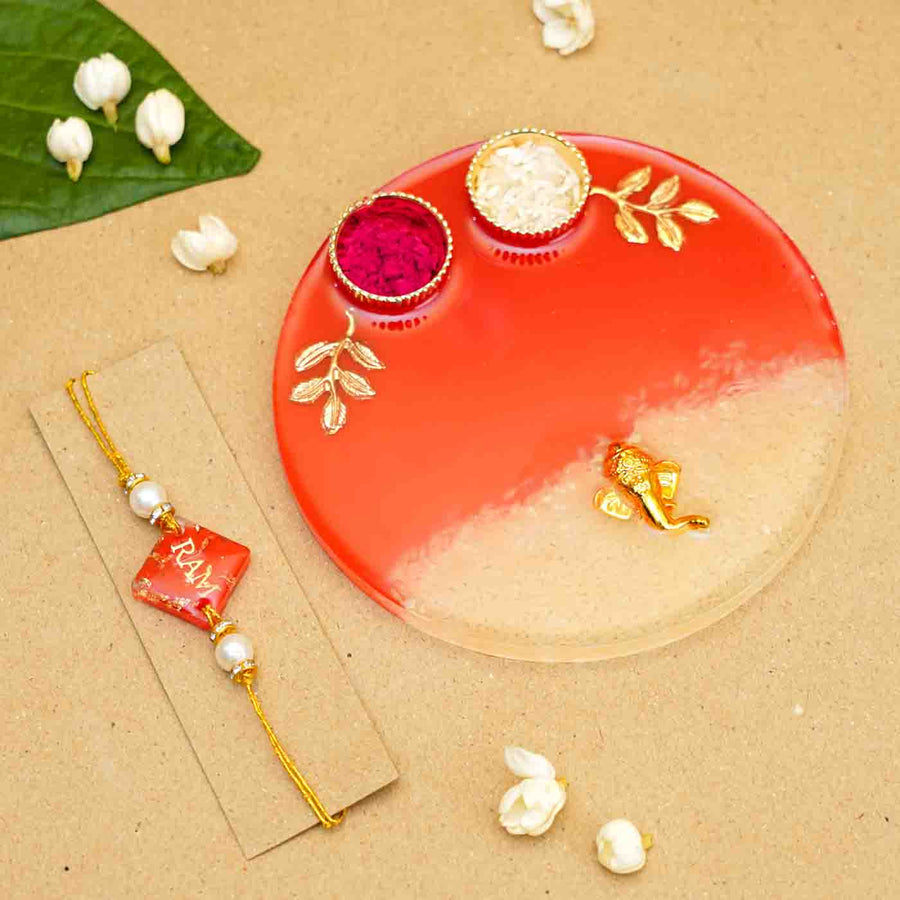 Personalized Handmade Red Resin Rakhi Thali With Roli Chawal For Brother Set Of 2 - Flat Lay with Rakhi and Plate