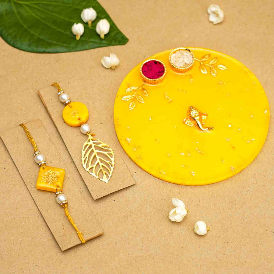 Personalized Handmade Yellow Resin Rakhi Thali With Roli Chawal For Bhaiya And Bhabhi Set Of 3 - Front View with Decor Elements