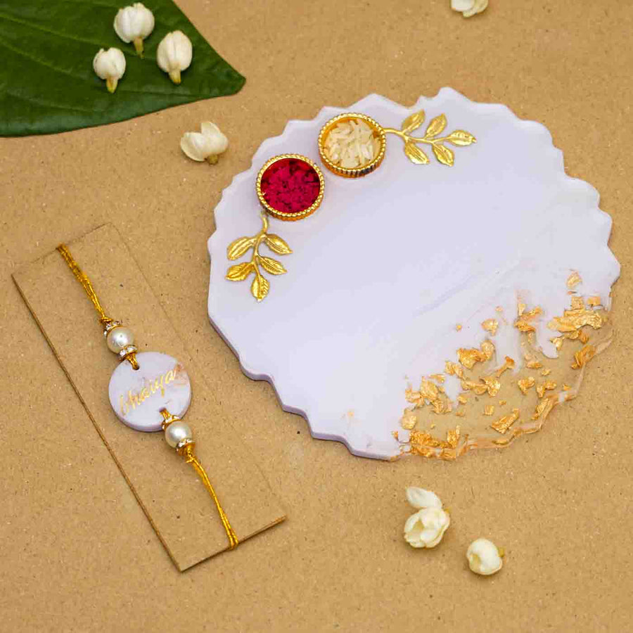 Personalized Handmade Lavendar Resin Rakhi Thali With Roli Chawal For Brother Set Of 2 - Flat Lay with Rakhi and Plate