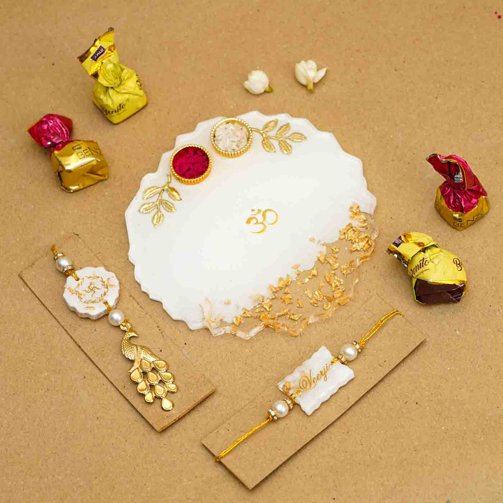 Personalized Handmade White Resin Rakhi Thali With Roli Chawal For Bhaiya And Bhabhi Set Of 3 - Overhead view with chocolates included