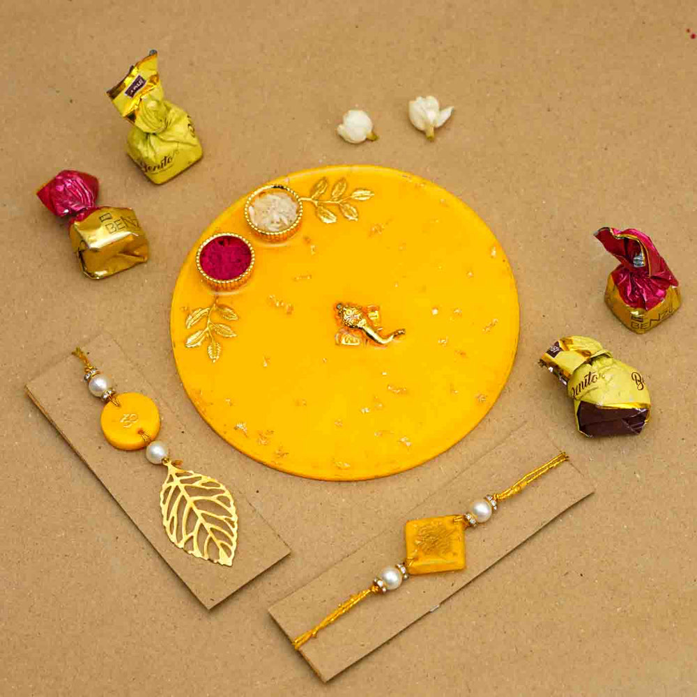 Personalized Handmade Yellow Resin Rakhi Thali With Roli Chawal For Bhaiya And Bhabhi Set Of 3 - Front View with Chocolates