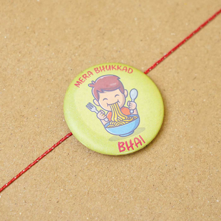 Reusable Printed Bhukkad Bhai Magnetic Metal Rakhi With Roli Chawal - Close-up of Badge with String