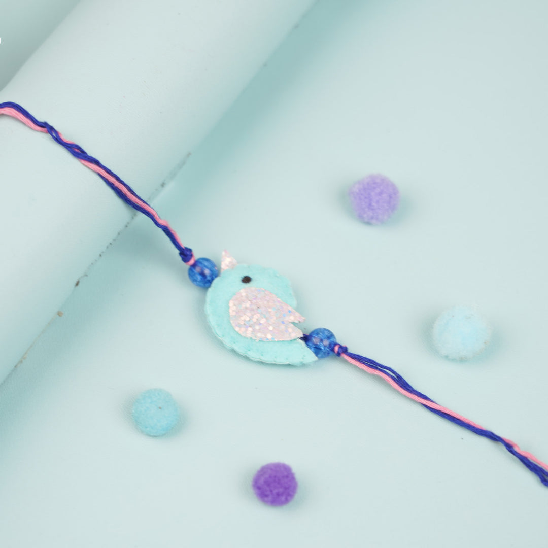 Handmade Blue Bird Theme Felt Kids Rakhi - Close-up of Bird Charm Bracelet
