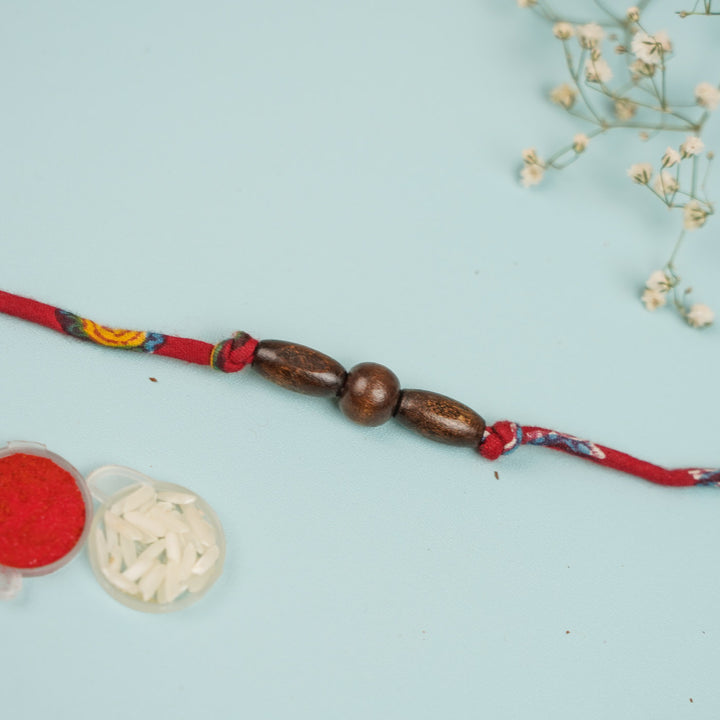 Handmade Beaded Wooden Rakhi For Brother - Beads with Accessories Nearby