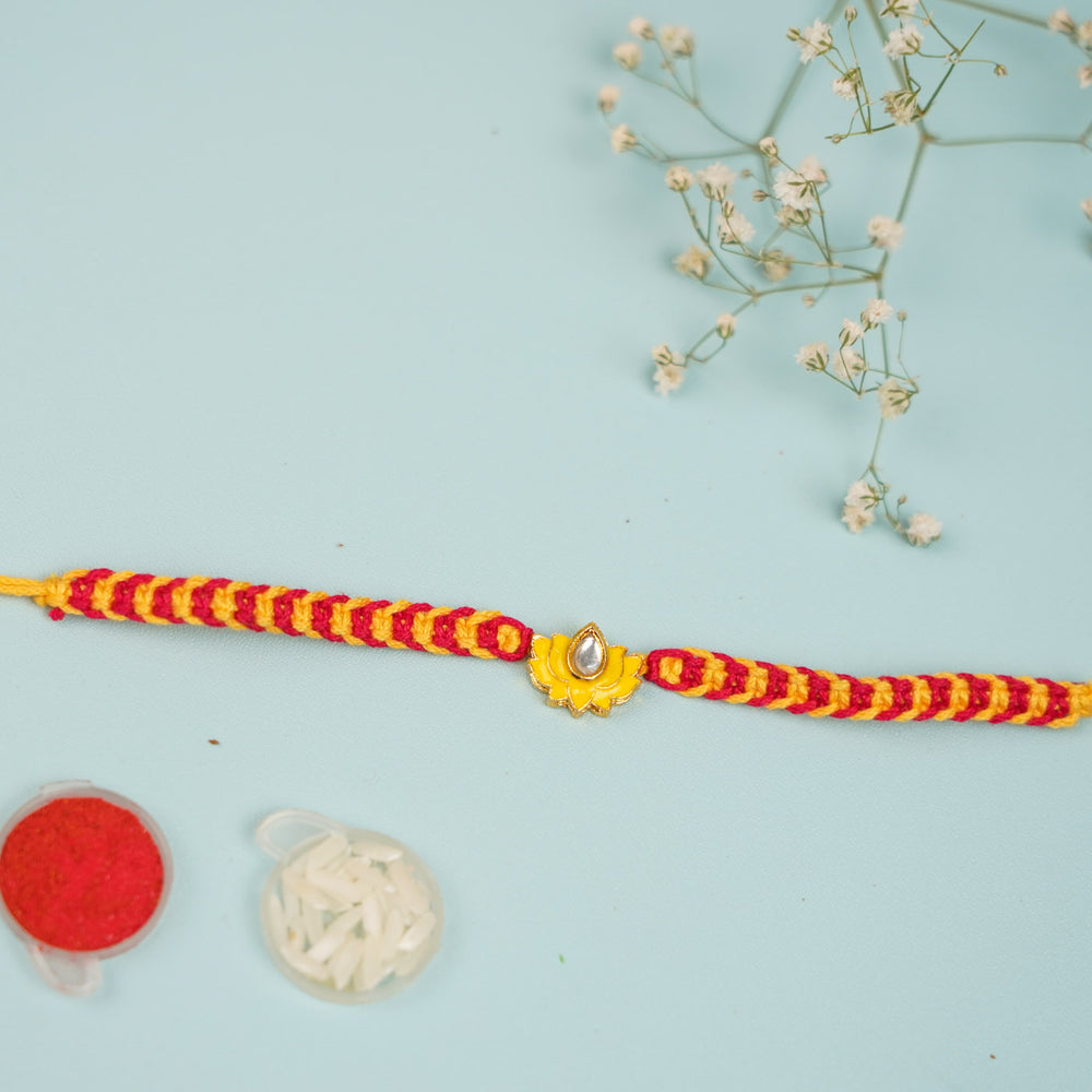 Handmade Kamala Design Metal Rakhi For Brother - Top View with Decorative Items