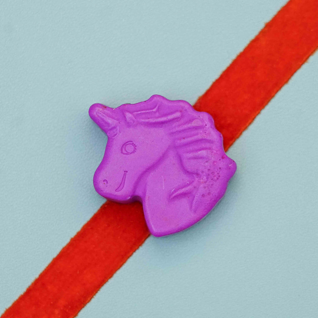 Handmade Unicorn Crayon Kids Rakhi With Roli Chawal - Close-up on Purple Unicorn Charm