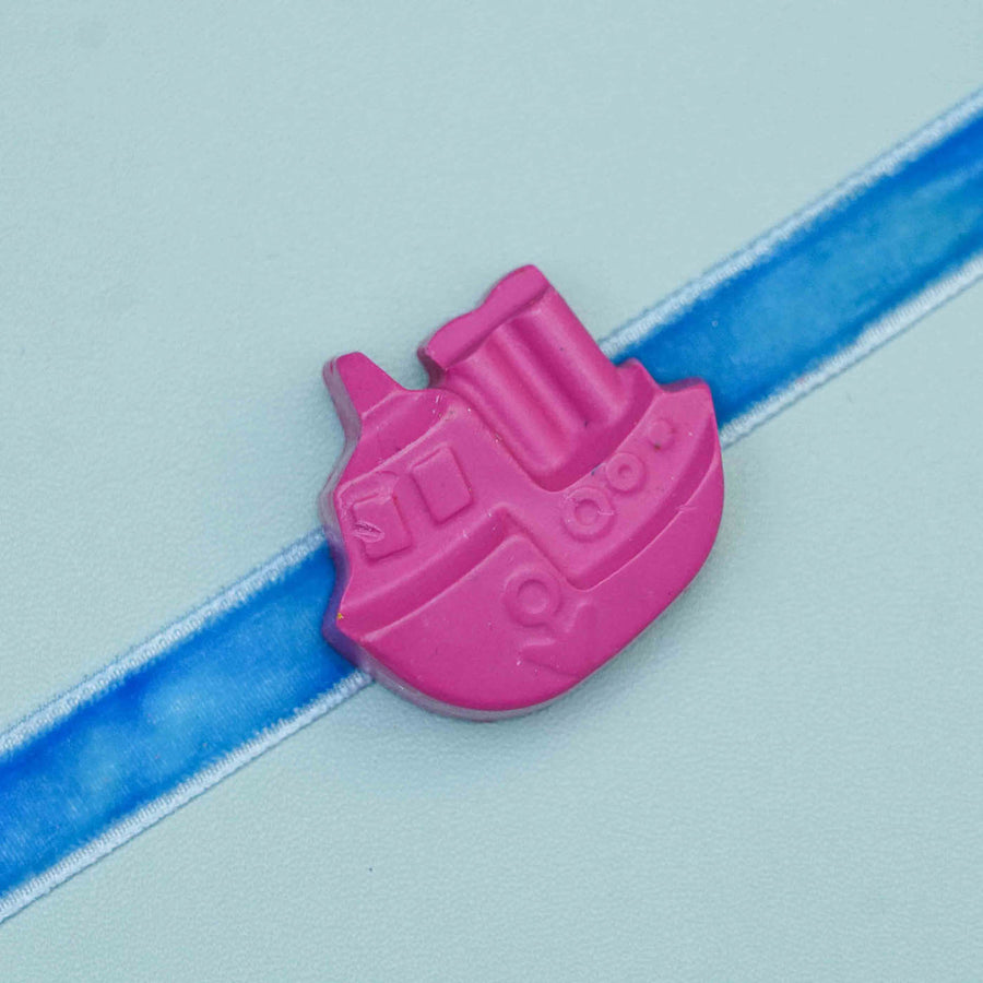Handmade Ship Crayon Kids Rakhi With Roli Chawal - Close-up on boat charm detail