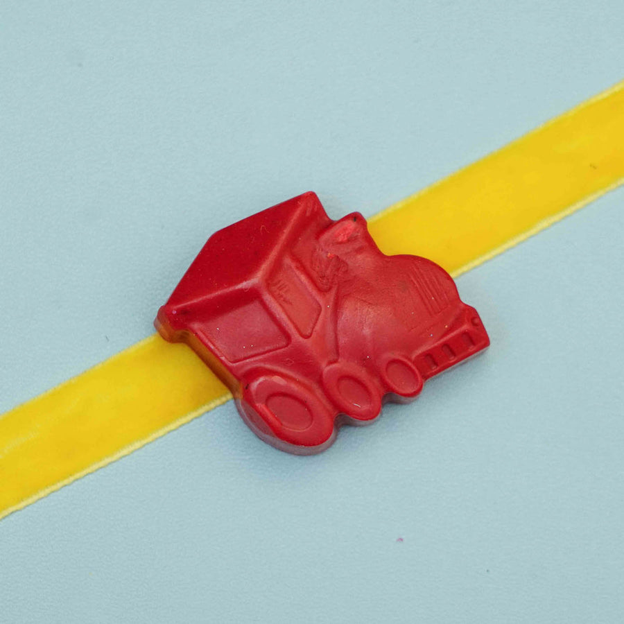 Handmade Train Crayon Kids Rakhi With Roli Chawal - Close-up on Train Shape Detail