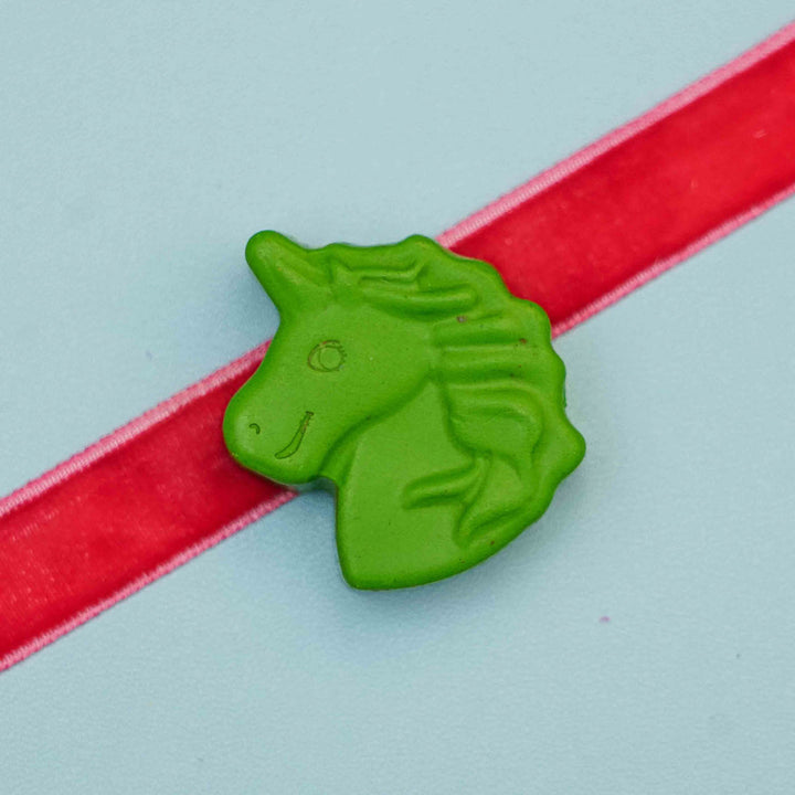 Handmade Unicorn Crayon Kids Rakhi With Roli Chawal - Close-up on Green Unicorn Charm