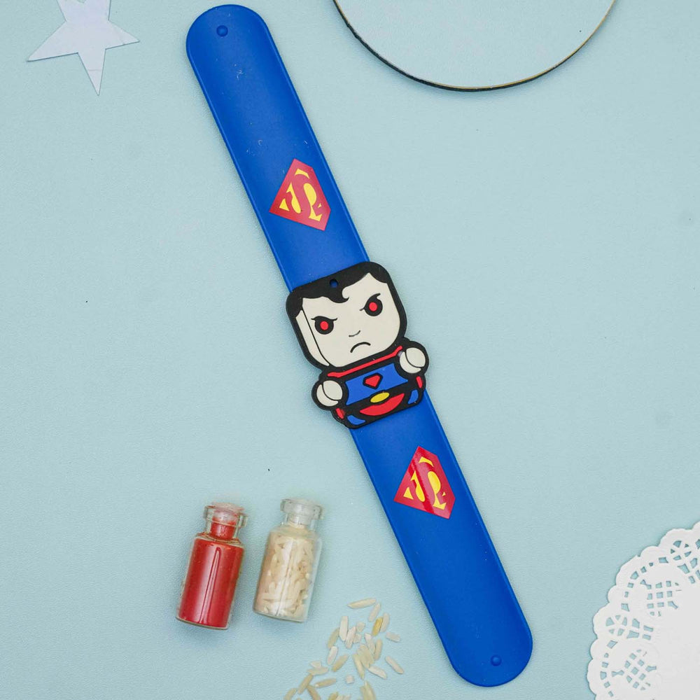 Handmade Superman Slap Band Kids Rakhi With Roli Chawal - Flat Lay View