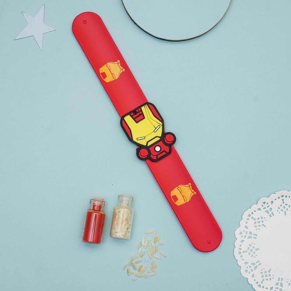 Handmade Iron Man Slap Band Kids Rakhi With Roli Chawal - Flat Lay Front View with Props
