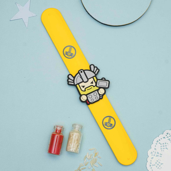 Handmade Thor Slap Band Kids Rakhi With Roli Chawal - Flat Lay Showing Full Band