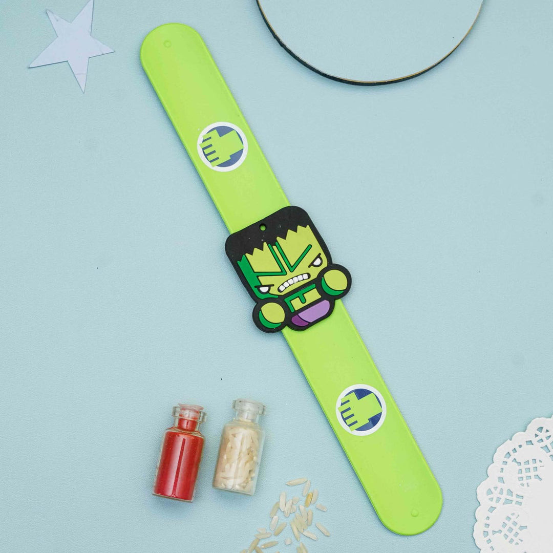 Handmade Hulk Slap Band Kids Rakhi With Roli Chawal - Lying Flat with Props