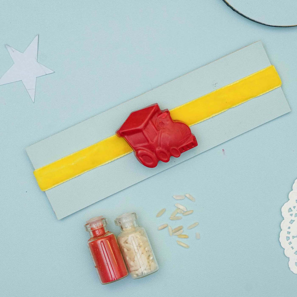 Handmade Train Crayon Kids Rakhi With Roli Chawal - Full View on Spritz Cookie with Decorations