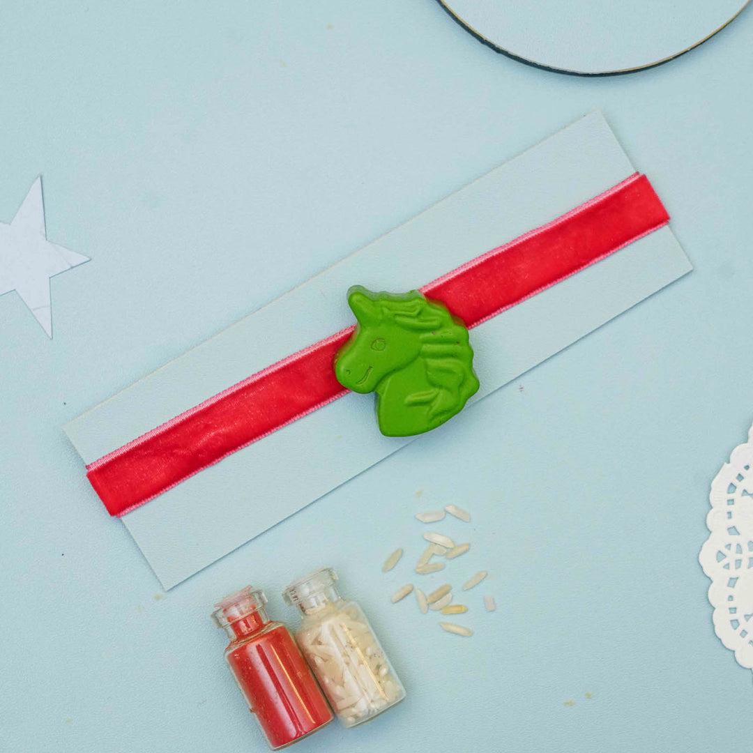 Handmade Unicorn Crayon Kids Rakhi With Roli Chawal - Green Unicorn Charm on Display Card