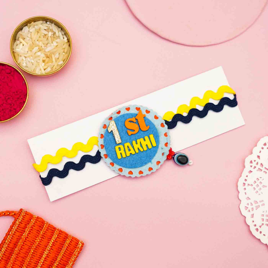 Handmade 1St Rakhi Felt Kids Rakhi With Roli Chawal 1 - Flat Lay with Rakhi on Card