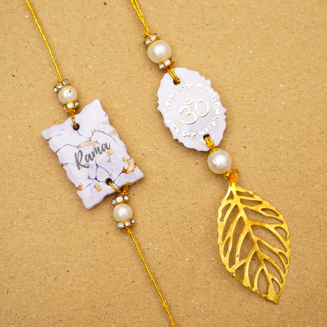Personalized Handmade Lavendar Resin Bhaiya Bhabhi Rakhi With Roli Chawal Set Of 2 - Flat Lay with Items and Name Close-up