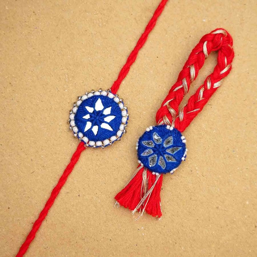 Handmade Mirror Work Kajal Blue Red Bhaiya Bhabhi Rakhi With Roli Chawal Set Of 2 - Close-up of Two Rakhis
