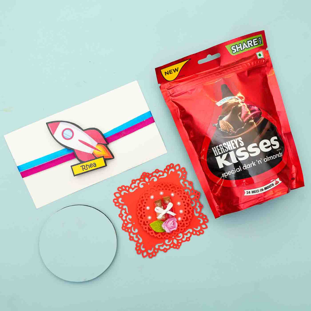 Personalized Reusable X Large Spaceship Mdf Wood Rakhi With Chocolates And Roli Chawal - Gift Bundle Packaging Arrangement