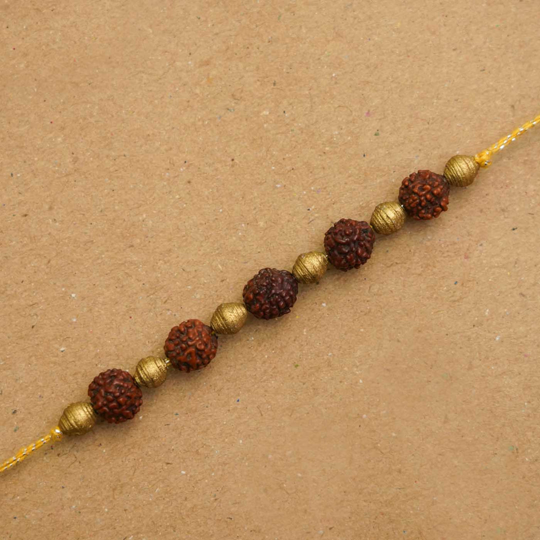 Handmade Ecofriendly Rudraksh Recycled Paper Rakhi With Roli Chawal - Close-up of string beads bracelet
