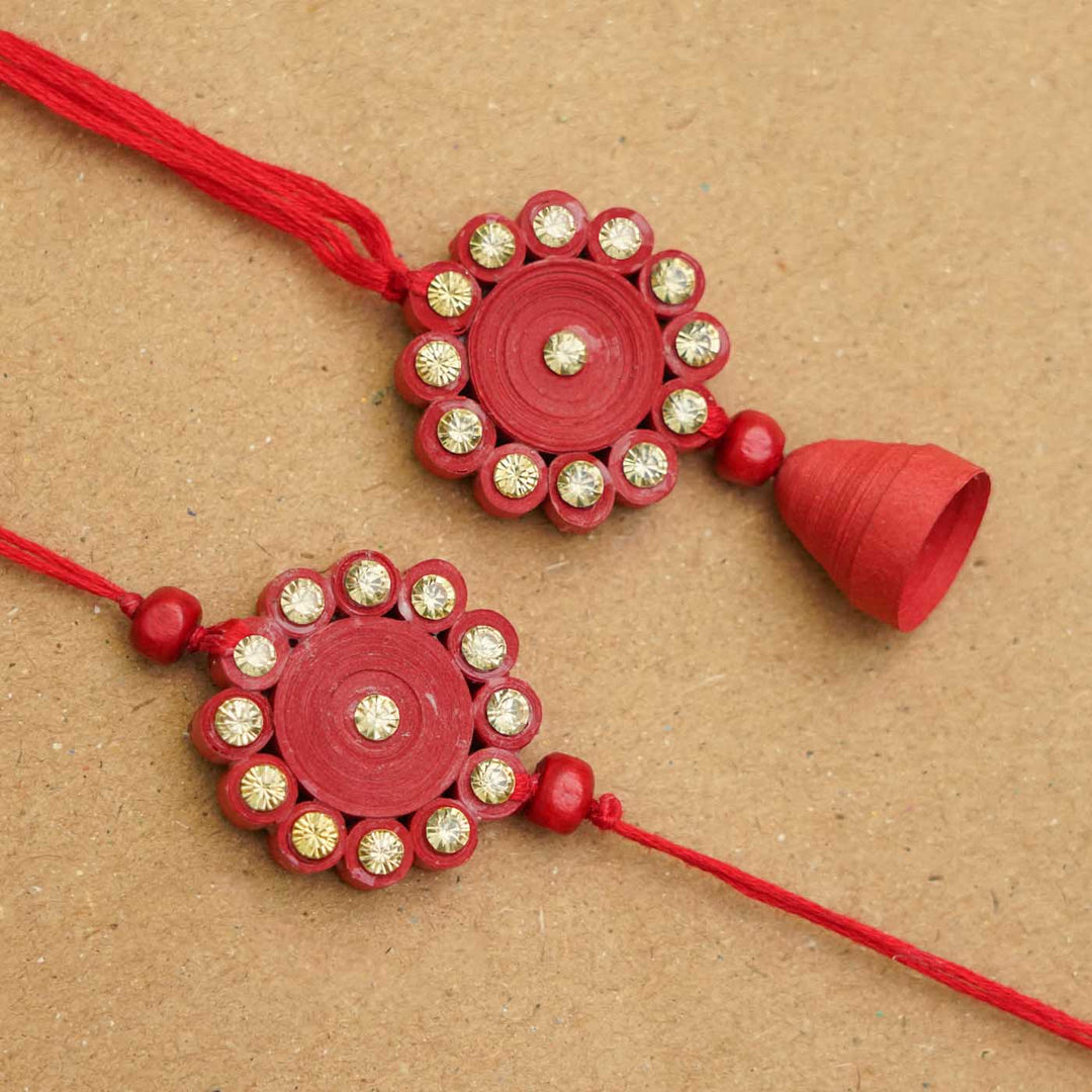 Handmade Ecofriendly Red Quilled Recycled Paper Bhaiya Bhabhi Rakhi With Roli Chawal - Close-up of two red Rakhis
