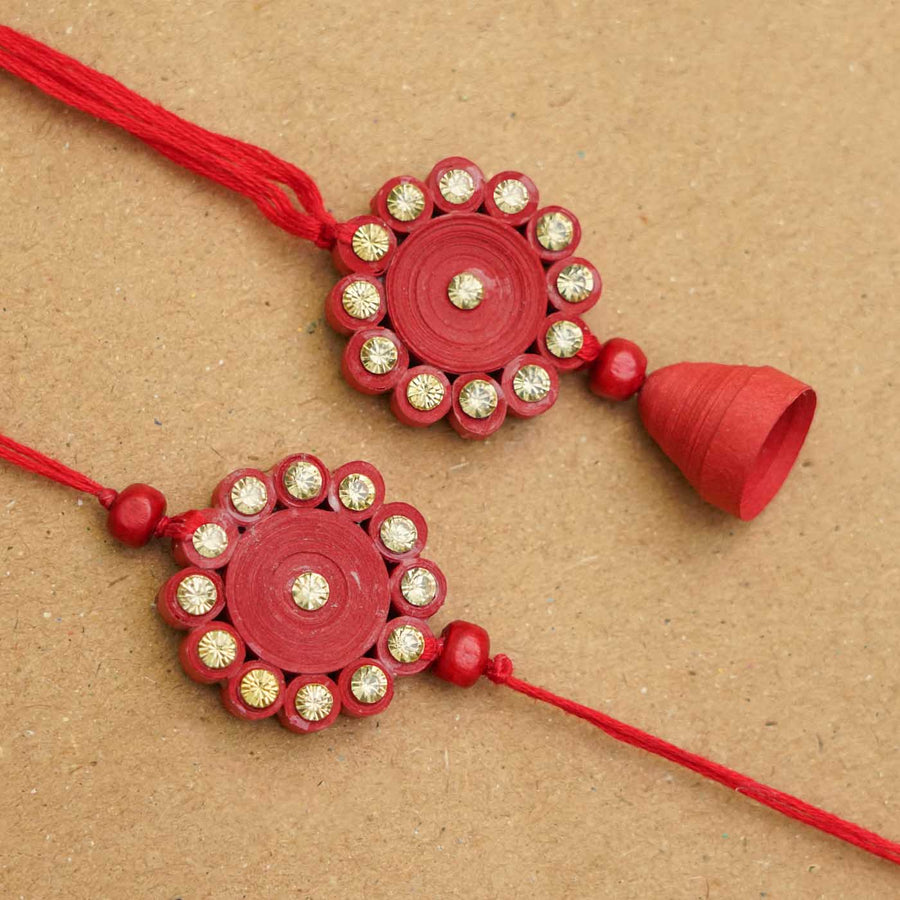 Handmade Ecofriendly Red Quilled Recycled Paper Bhaiya Bhabhi Rakhi With Roli Chawal - Close-up of two red Rakhis