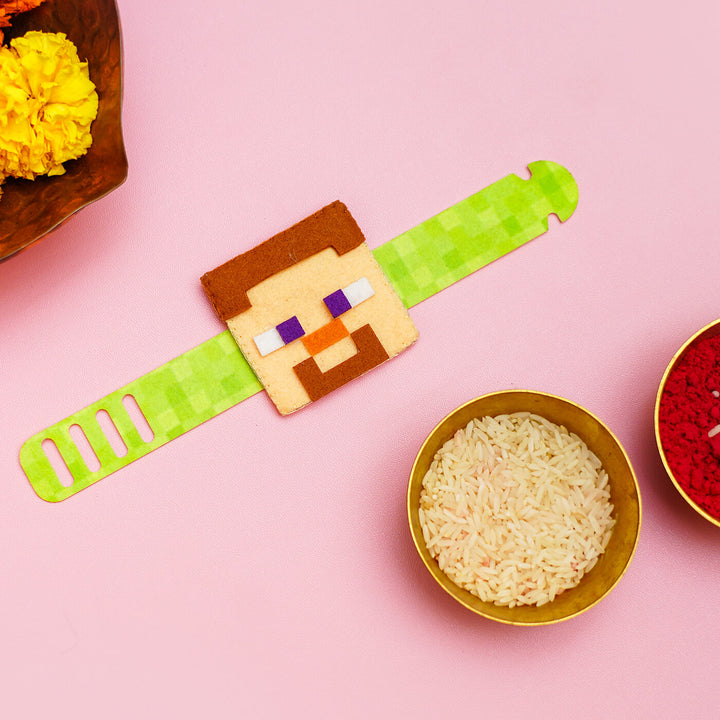 Handcrafted Minecraft Felt Rakhi For Kids With Roli Chawal - Laid Flat with Decorative Bowls