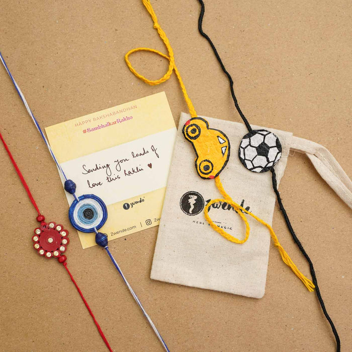 Handmade Ecofriendly Red Quilled Recycled Paper Bhaiya Bhabhi Rakhi With Roli Chawal - Rakhis with packaging and note card