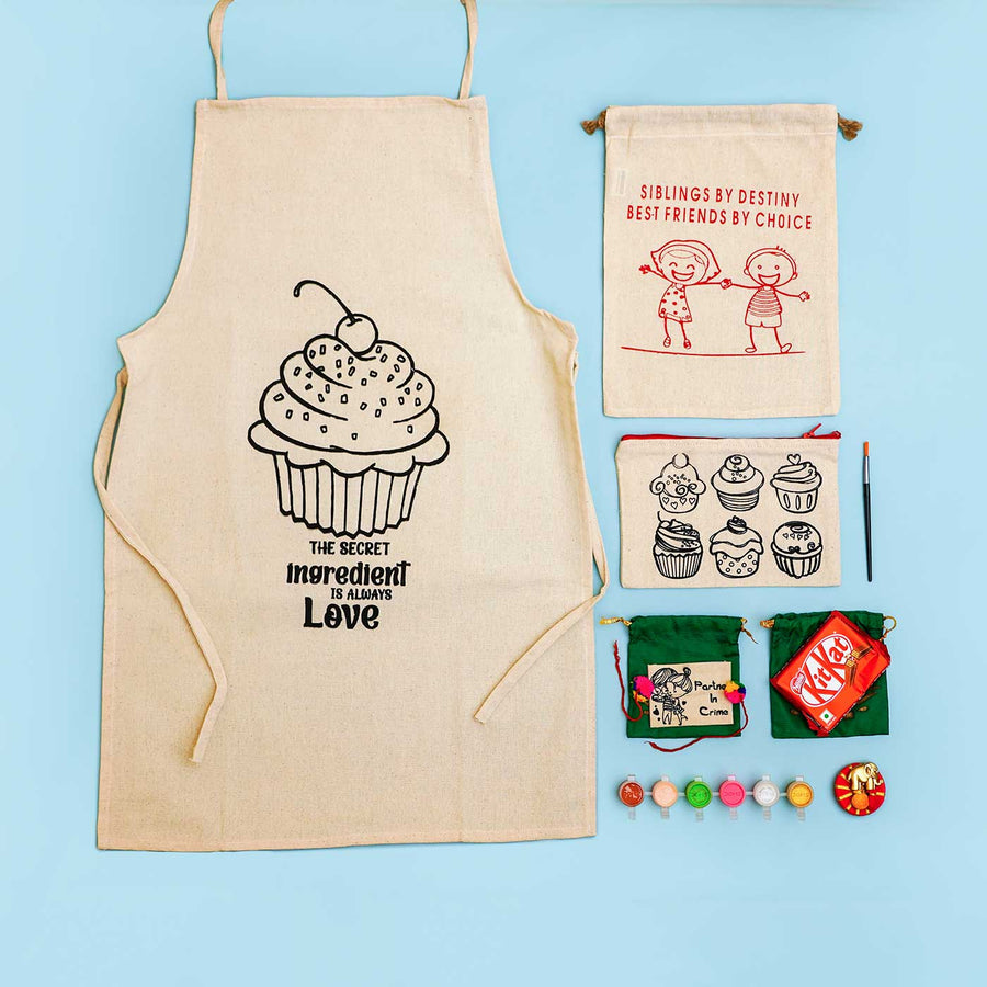 Eco Friendly Fabric Painting Diy Rakhi Hamper With Rice Roli 3 - Front view of apron and accessories
