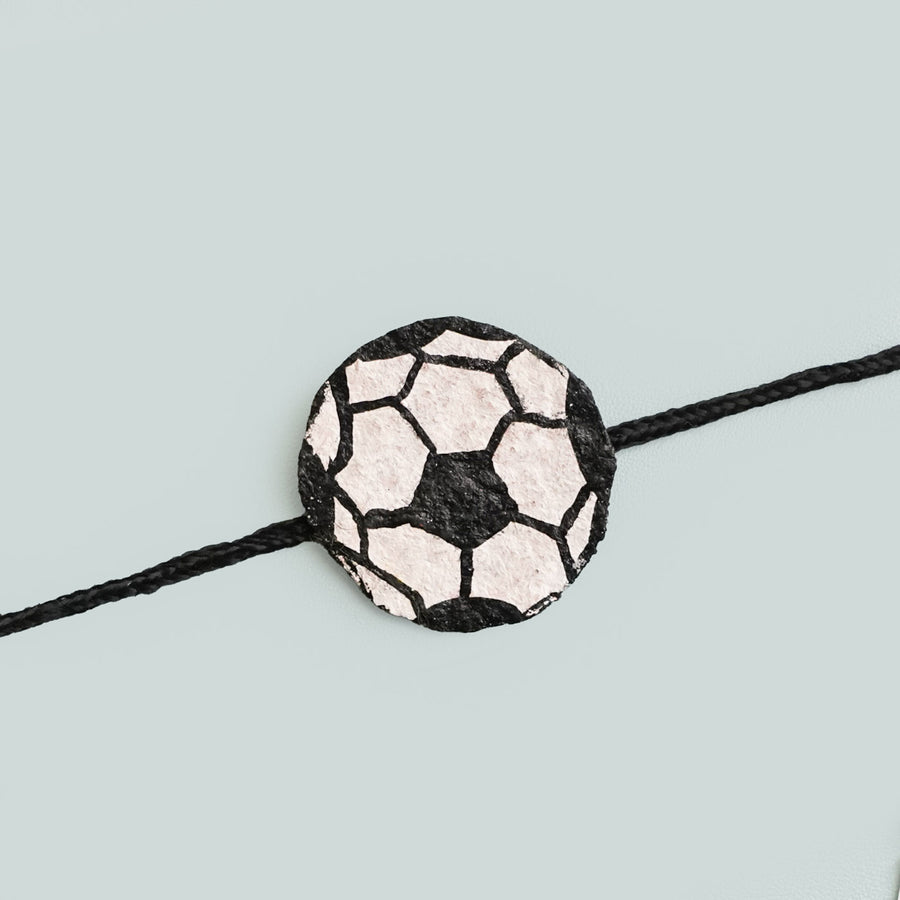 Handmade Ecofriendly Football Recycled Paper Rakhi With Roli Chawal - Close-up of soccer ball charm