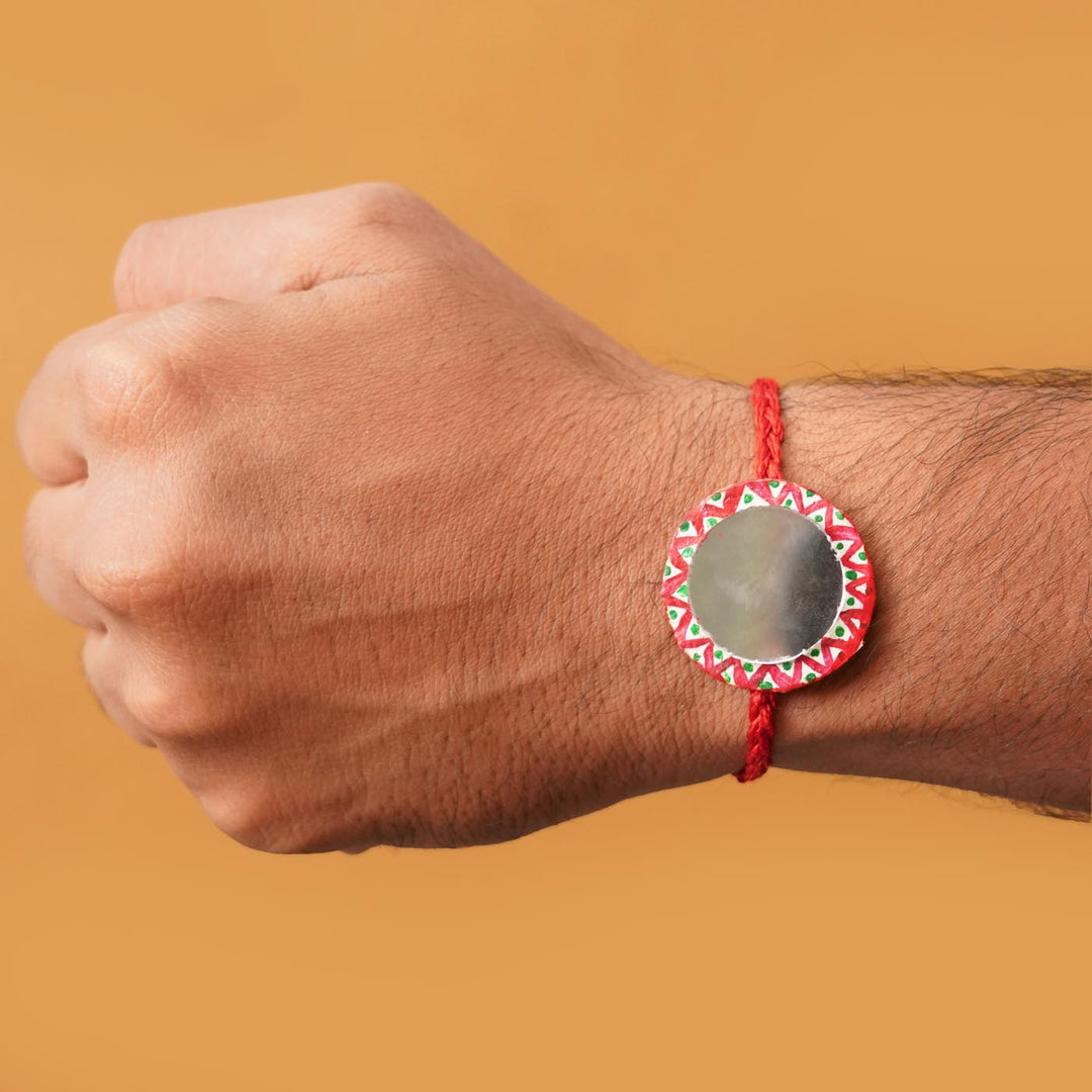 Handmade Ecofriendly Full Moon Recycled Paper Rakhi With Roli Chawal - Worn on wrist for size reference